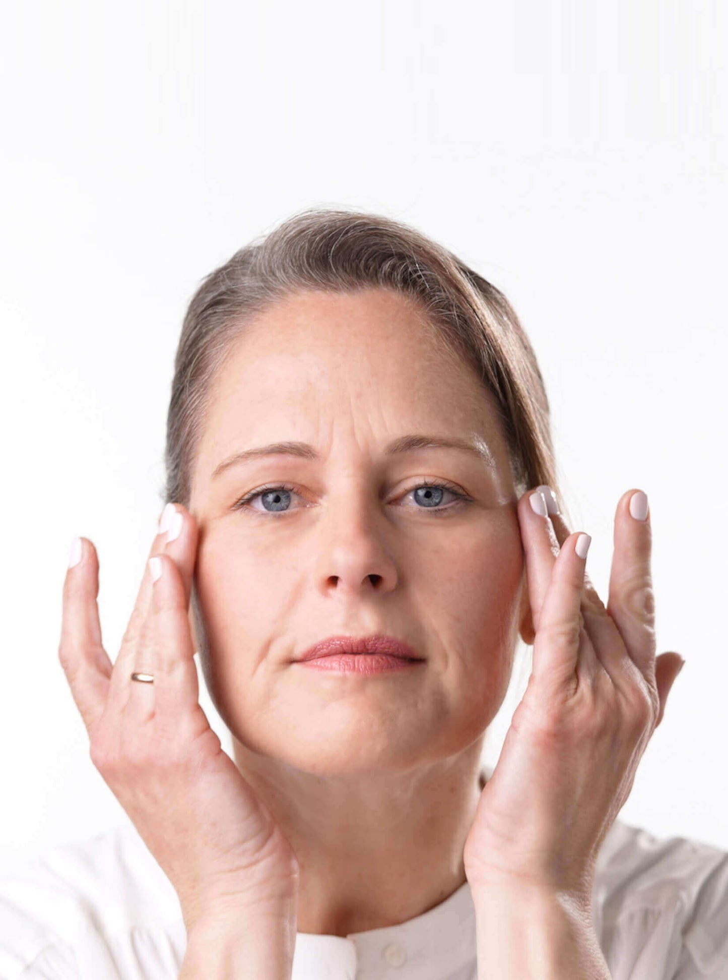Woman Applying  Anti-Aging Eye Cream